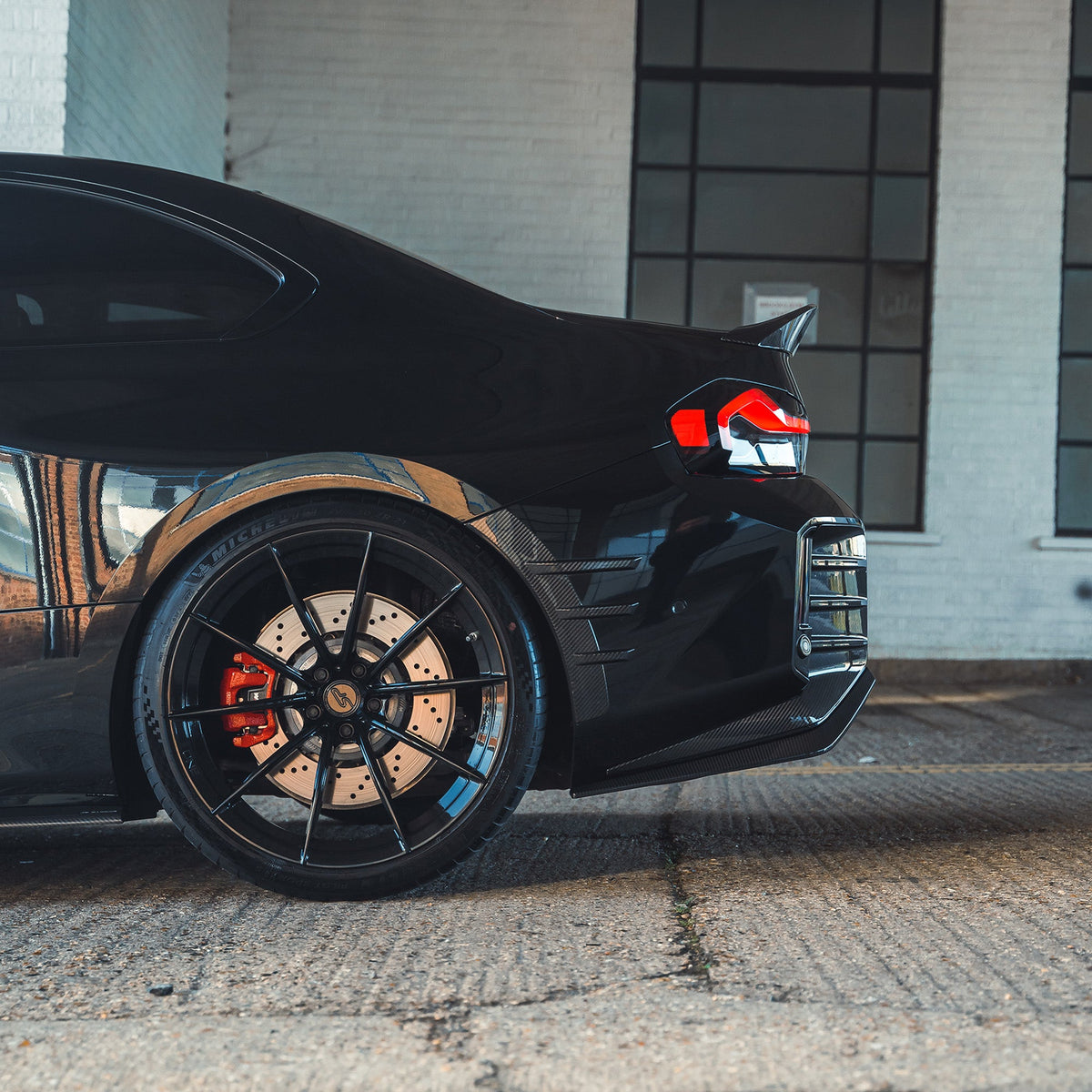 BMW G87 M2 and G42 2 Series carbon fibre spoiler by CT Design, showcasing sleek, lightweight aerodynamic car accessory.
