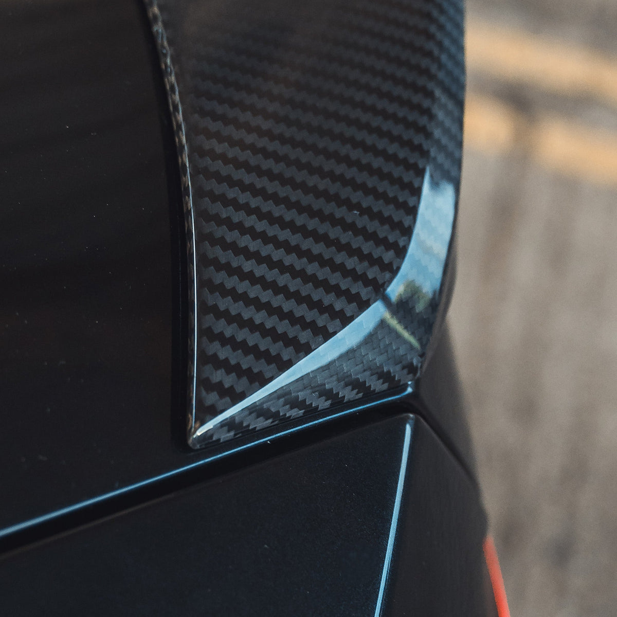 BMW G87 M2 and G42 2 Series carbon fibre spoiler by CT Design, showcasing its sleek, aerodynamic design on a sports car.