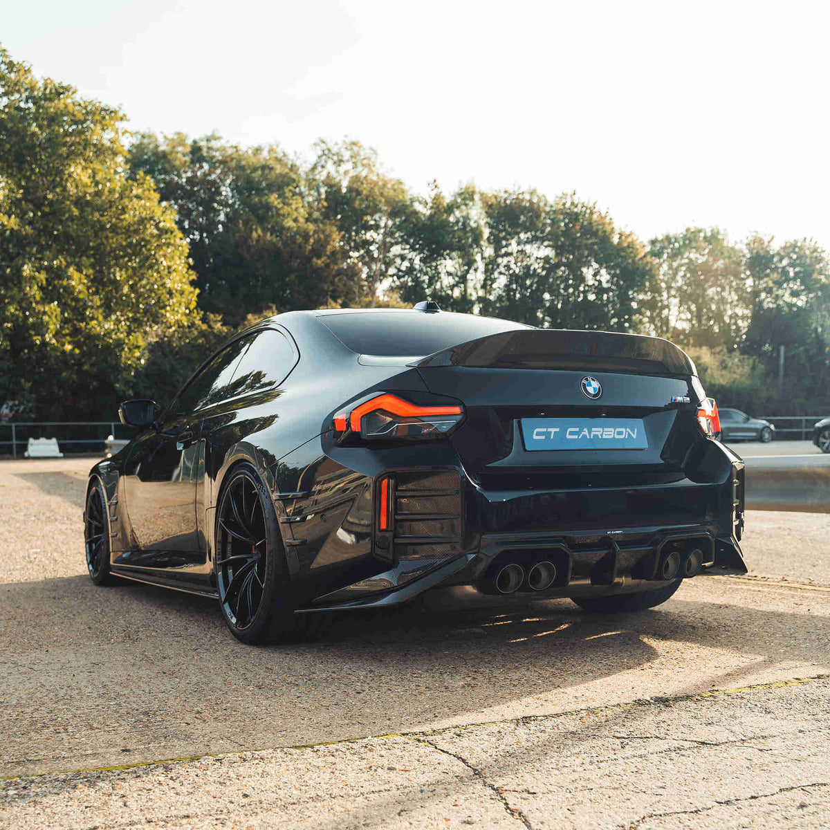 BMW G87 M2 and G42 2 Series carbon fibre spoiler by CT Design, showcasing its sleek, aerodynamic design and glossy finish.