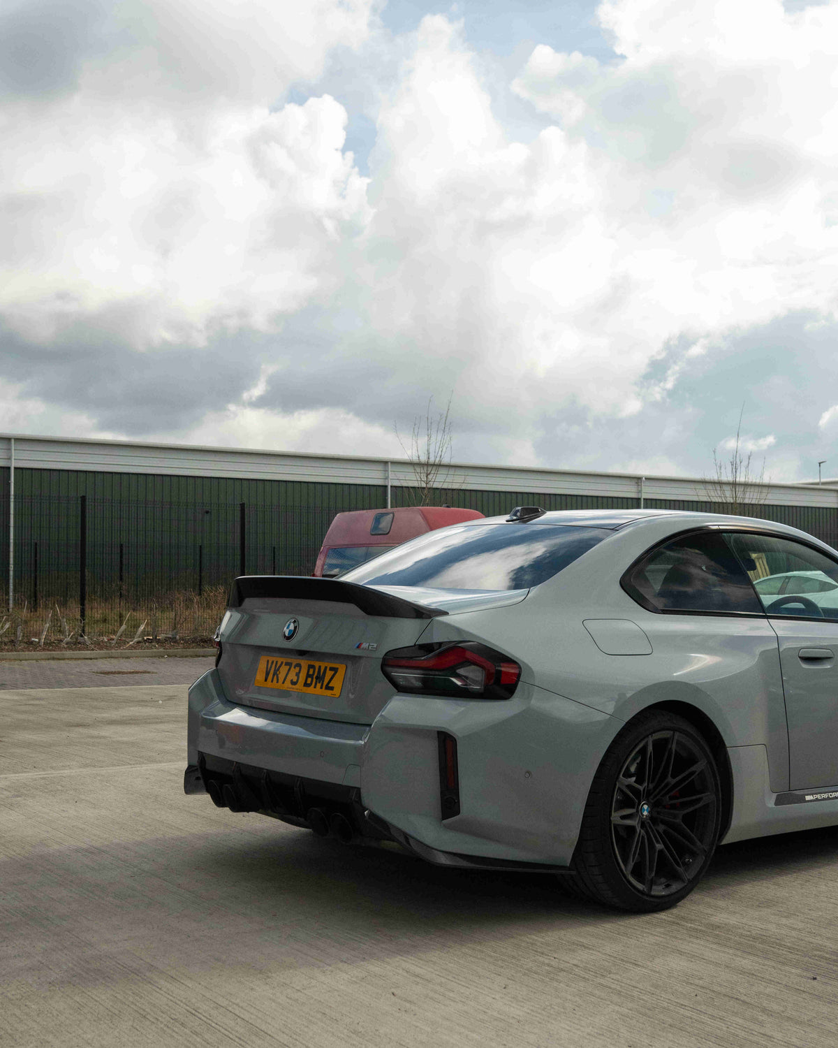 BMW G87 M2 and G42 2 Series carbon fibre spoiler by CT Design, showcasing sleek aerodynamic design on a sports car.