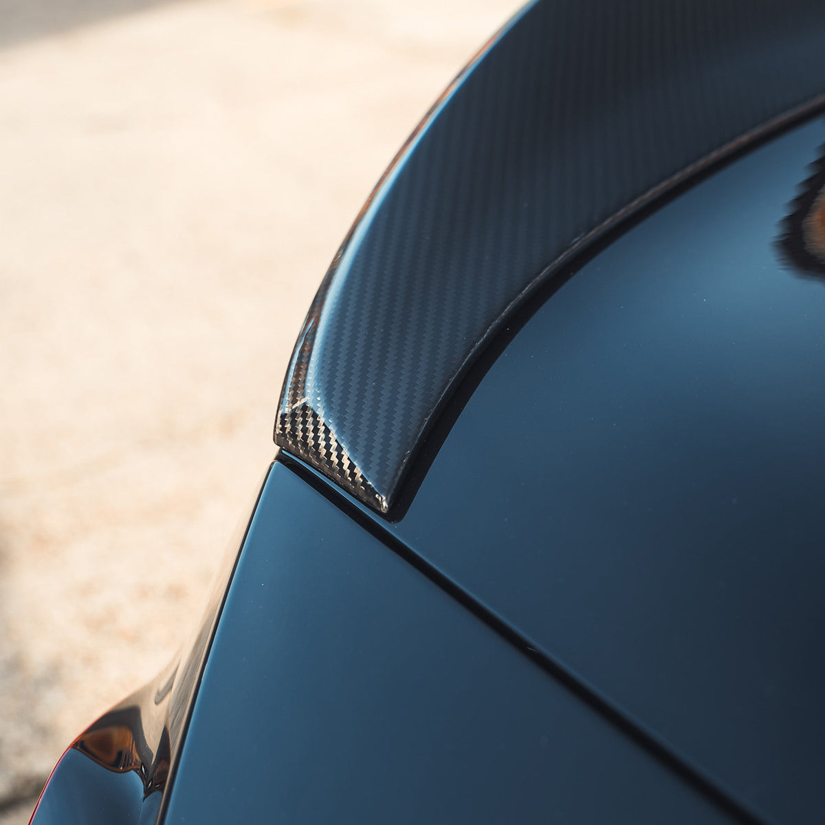 BMW G87 M2 and G42 2 Series carbon fibre spoiler by CT Design, showcasing sleek aerodynamic design and glossy finish.