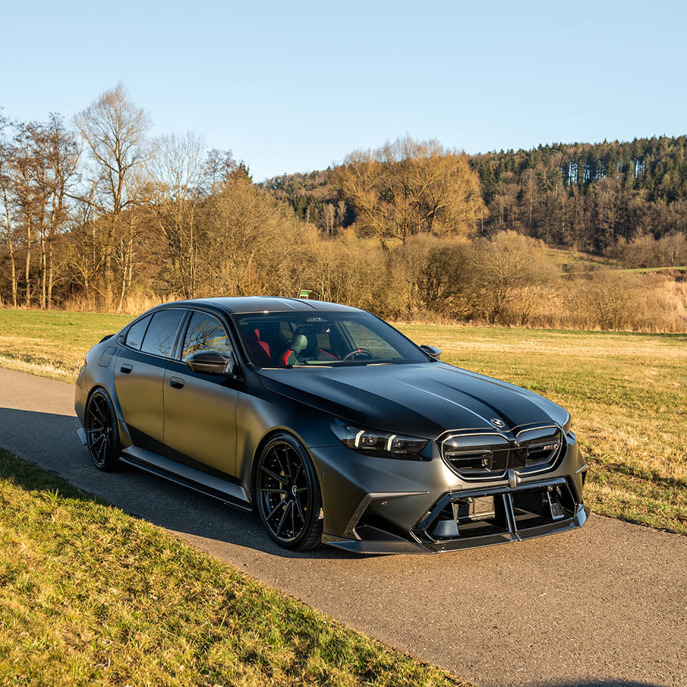 BMW G90 G99 M5 2024+ carbon fibre front bumper trim by CT Design, showcasing lightweight, aerodynamic accessory for sporty look.
