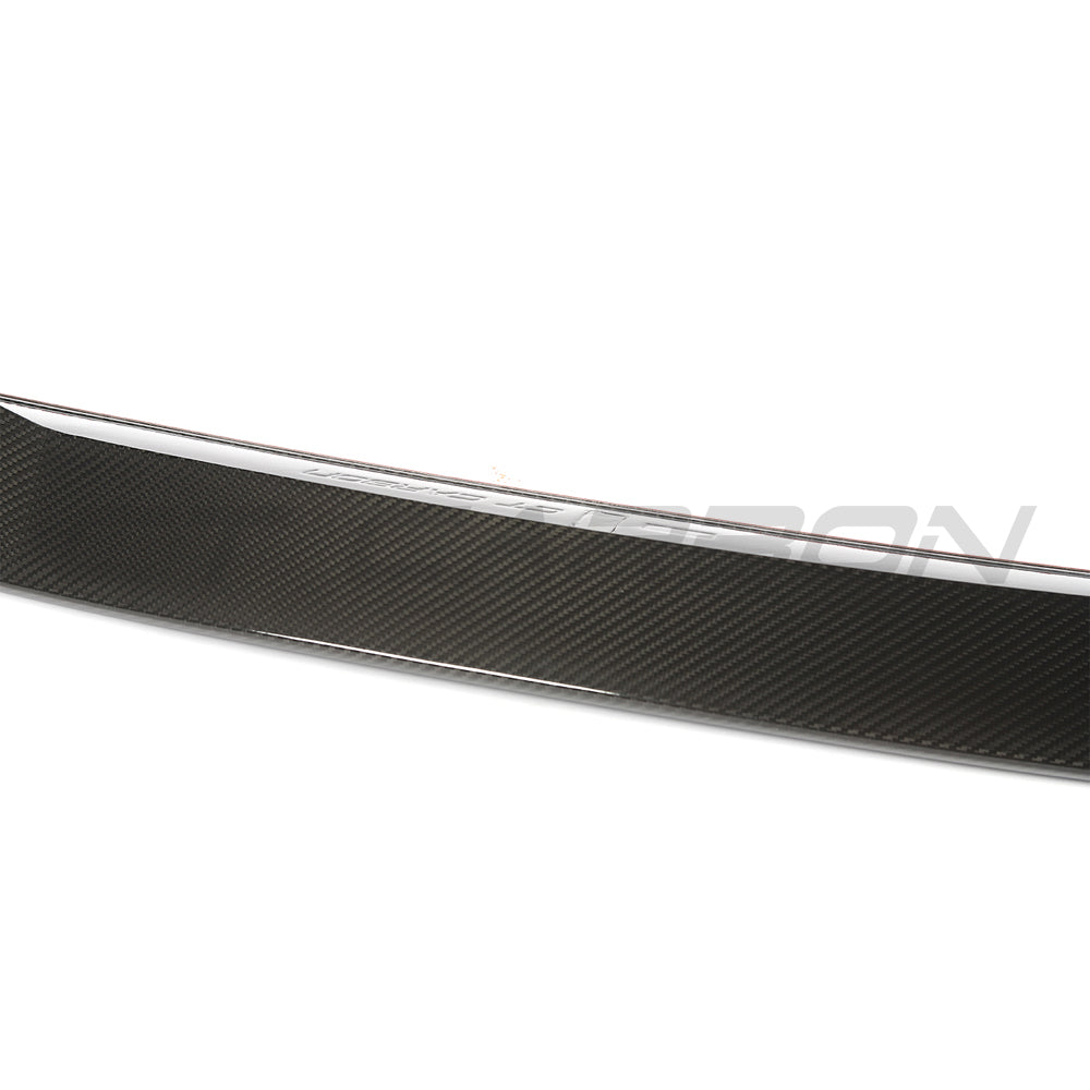 BMW G90 M5 and G60 5 Series 2023 carbon fibre spoiler by CT Design, showcasing sleek aerodynamic design and carbon fiber finish.