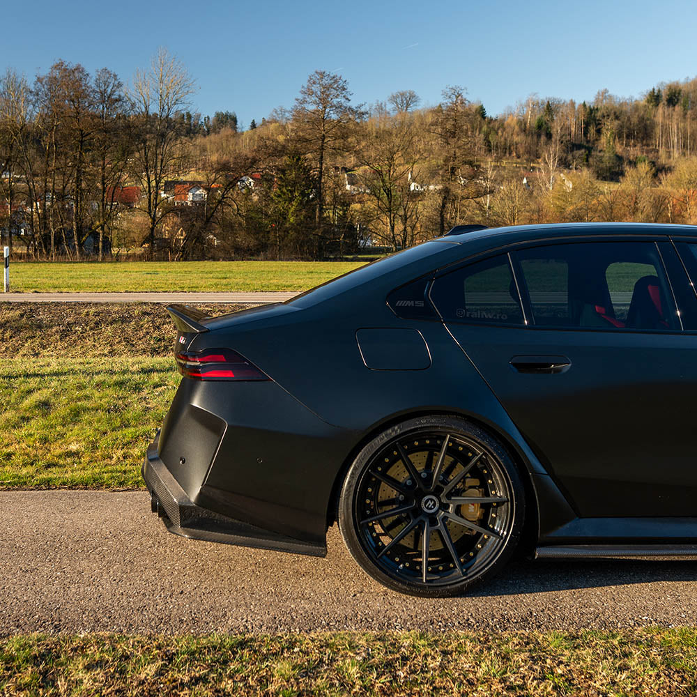 BMW G90 M5 and G60 5 Series 2023 carbon fibre spoiler by CT Design, showcasing sleek, aerodynamic design on the car's rear.