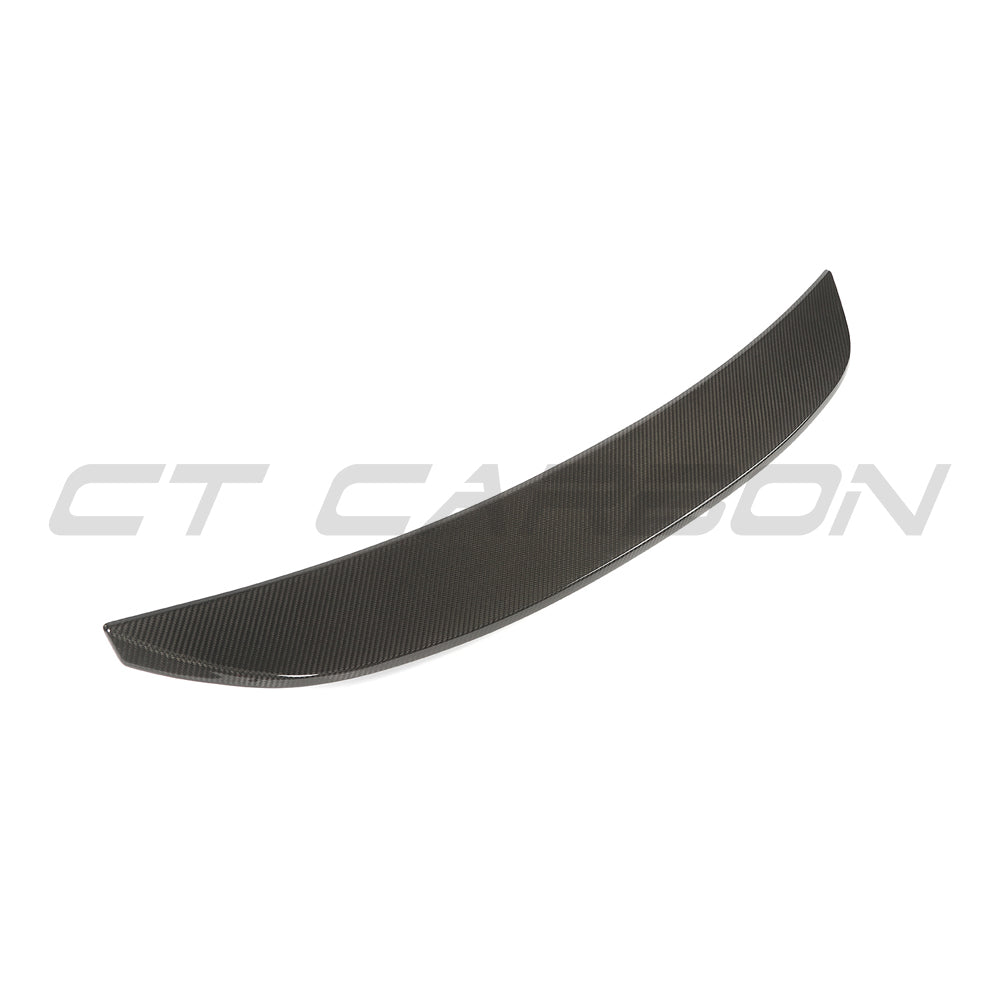 BMW G90 M5 and G60 5 Series 2023 carbon fiber spoiler by CT Design, showcasing sleek, aerodynamic design on the vehicle's rear.