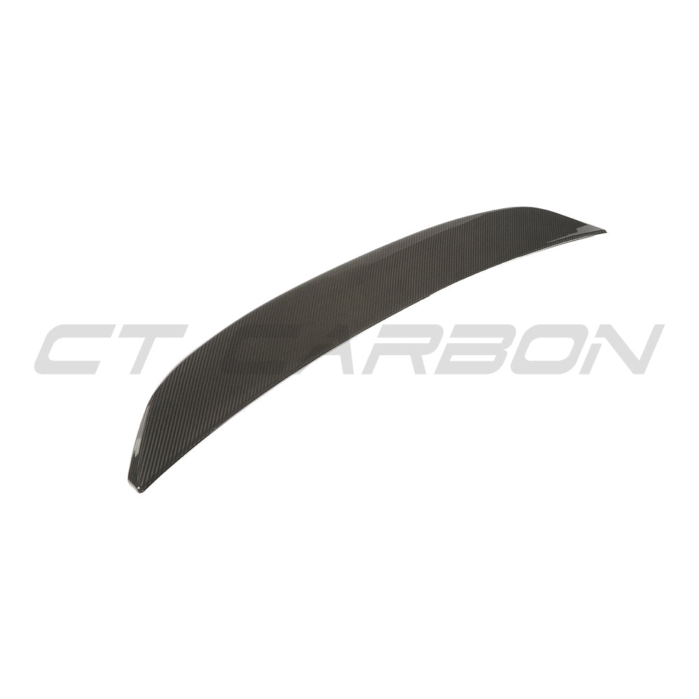 BMW G90 M5 and G60 5 Series 2023 carbon fiber spoiler by CT Design, showcasing sleek aerodynamic design on the car.
