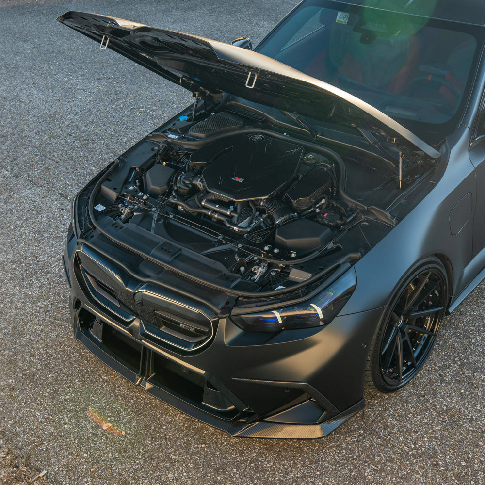 BMW G90 G99 M5 Touring 2024 carbon fibre engine cover by CT Design, showcasing sleek, lightweight car accessories.