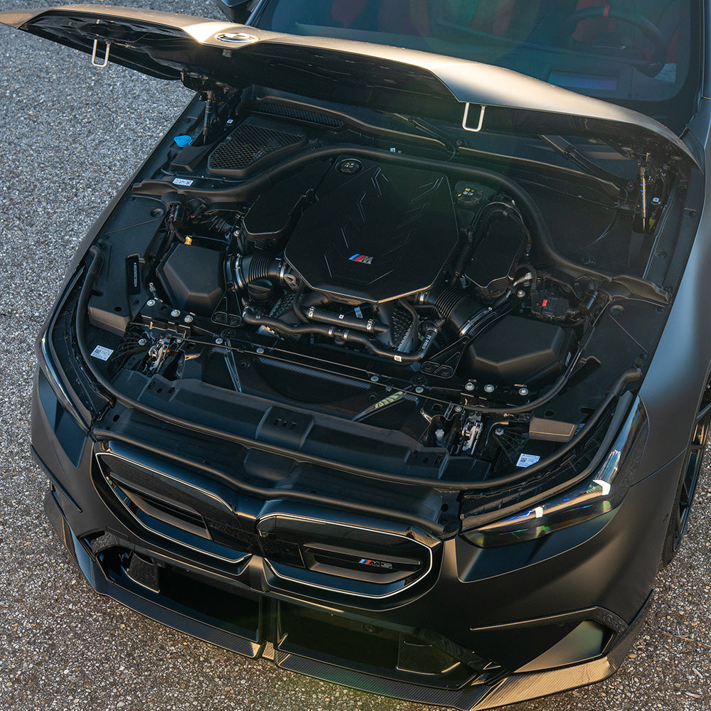 BMW G90 G99 M5 2024 carbon fiber engine cover from CT Design, showcasing a sleek, lightweight upgrade for M5 touring models.