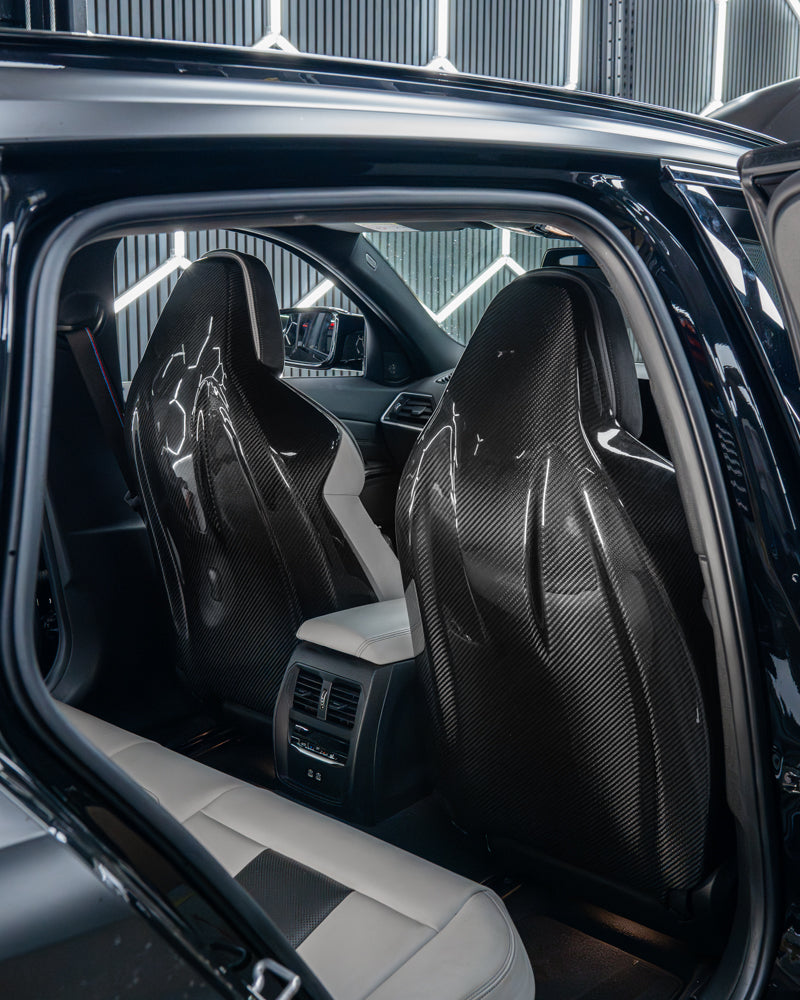BMW GXX/F9X carbon fibre seat backs by CT Carbon, showcasing sleek, lightweight full carbon fiber material for interior upgrade.