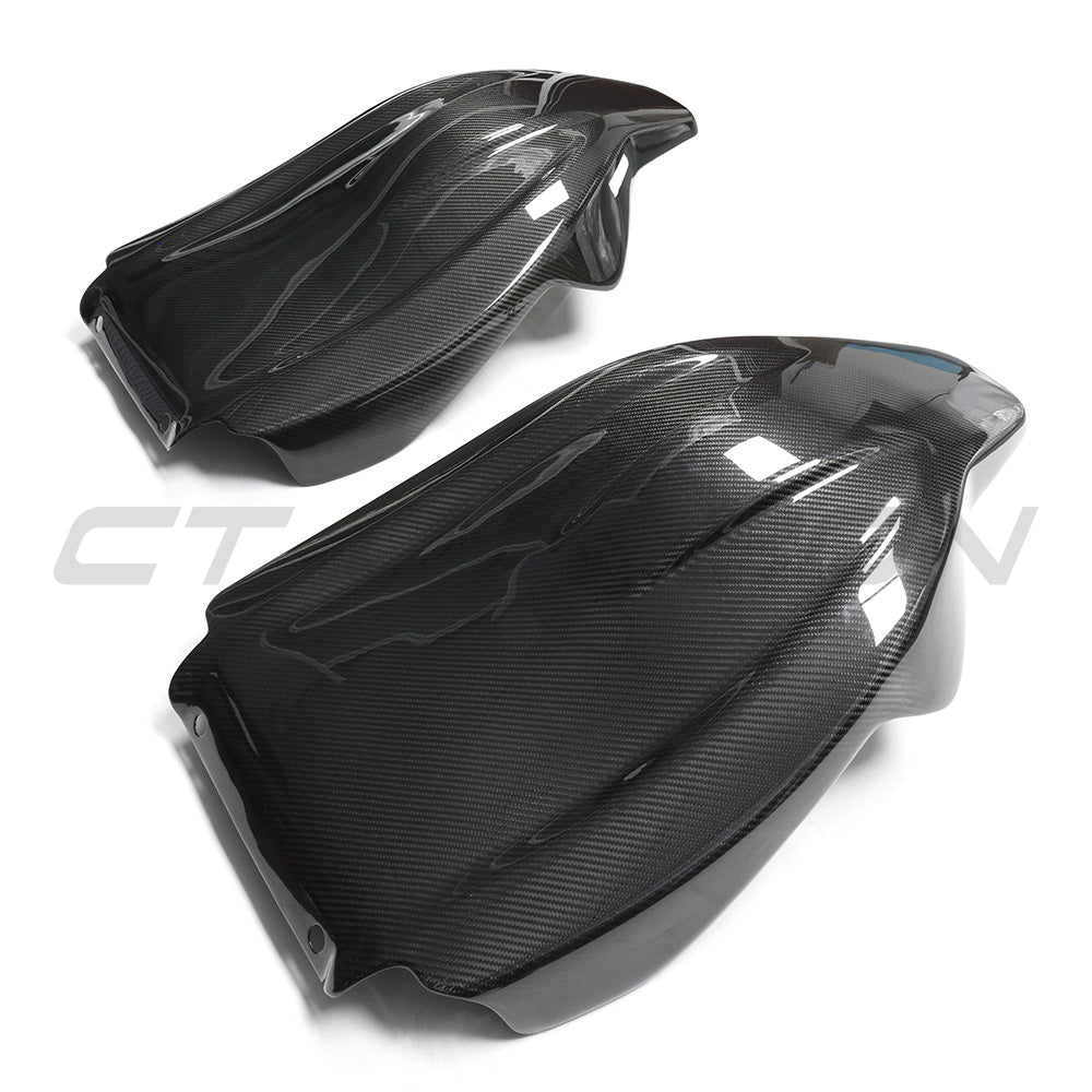 BMW GXX/F9X carbon fiber seat backs by CT Carbon, showcasing sleek, lightweight full carbon fiber interior accessories.
