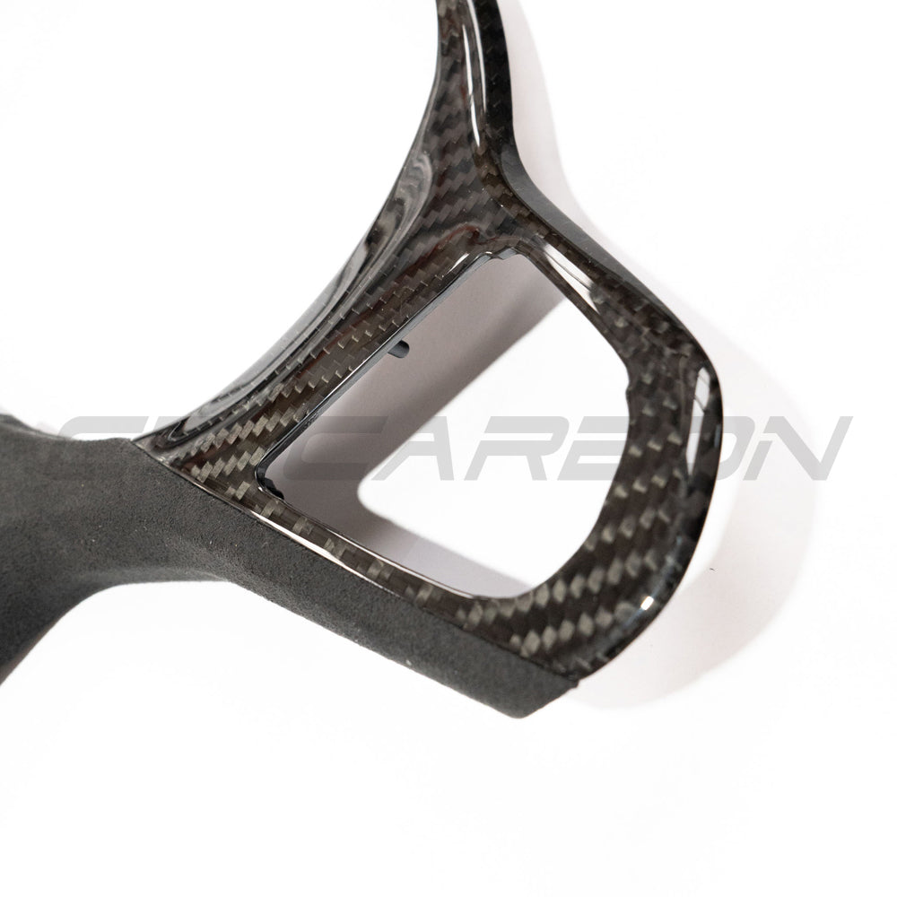 BMW Gxx M/M-SPORT carbon fiber steering wheel trim accessory by CT Carbon, showcasing sleek carbon fiber finish for enhanced interior style.