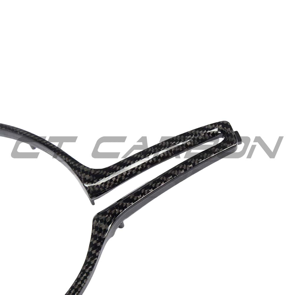BMW M Fxx carbon fiber steering wheel trim accessory by CT Carbon, showing close-up of sleek, textured carbon fiber finish.