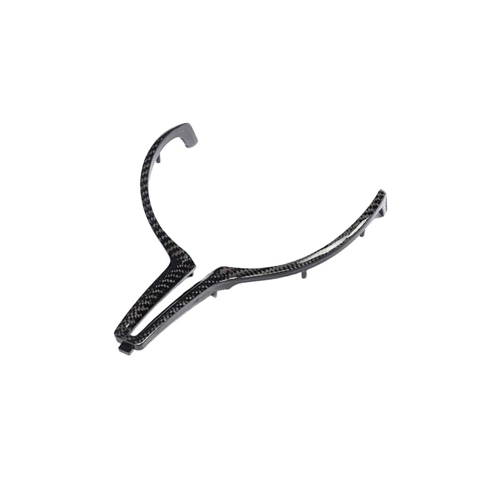 BMW M Fxx carbon fibre steering wheel trim accessory by CT Carbon, showing the sleek, glossy finish on the steering wheel.