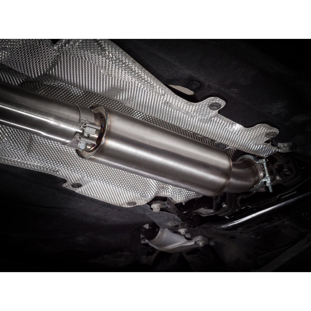 Cobra Sport BMW M135i F40 Venom Turbo Back Box Delete Race Performance Exhaust installed on the vehicle's rear, showcasing the exhaust system.
