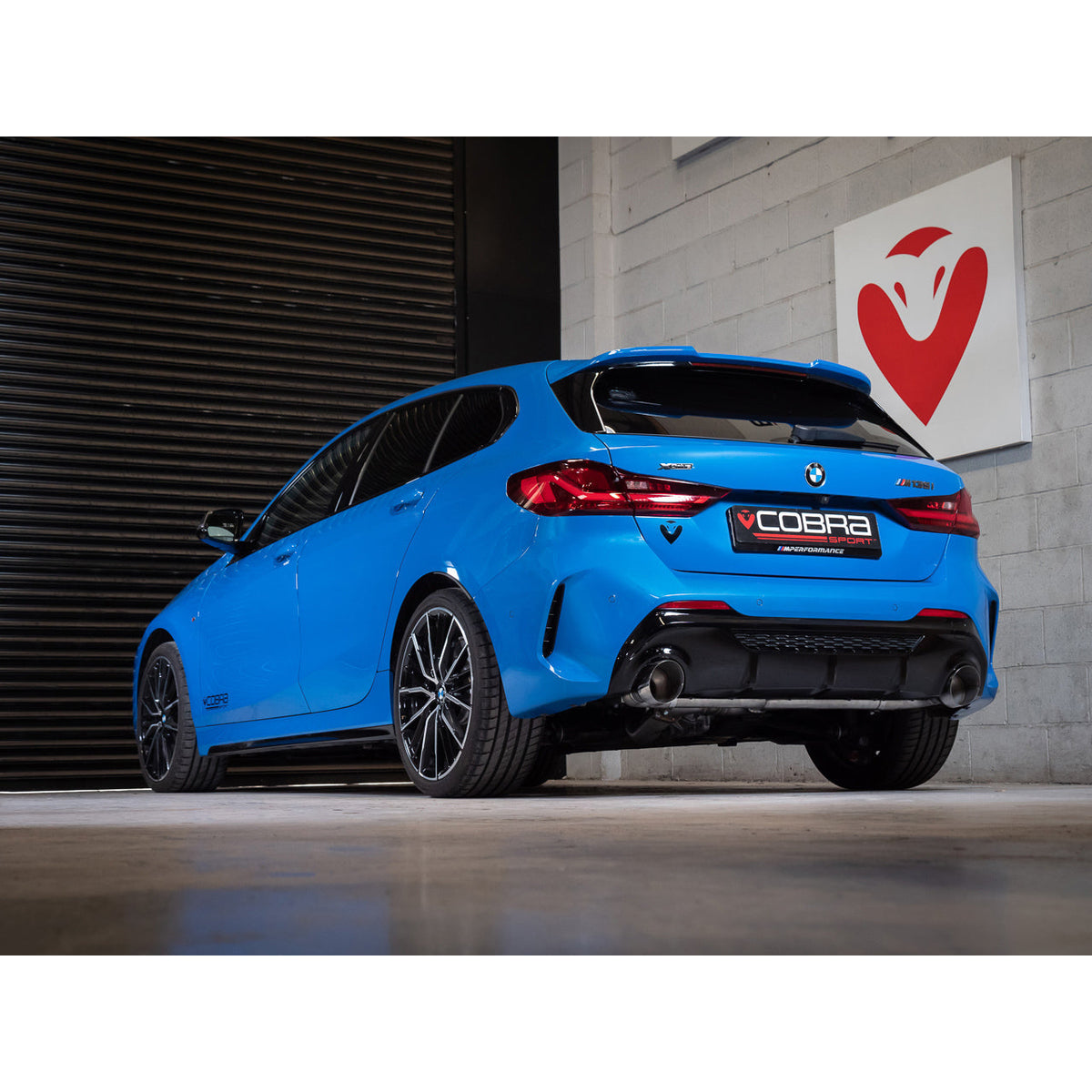 Cobra Sport turbo back exhaust for BMW M135i F40 with Venom Turbo Back Box Delete, showcasing polished metal piping and exhaust tips.
