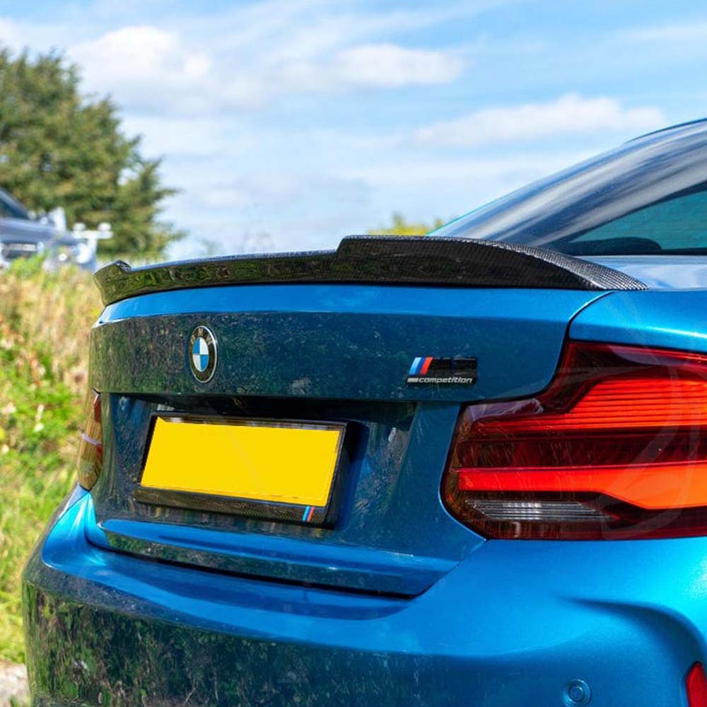 BMW M2 F87 and F22 carbon fiber spoiler by CT Carbon, sleek racing-style spoiler on the car's rear.