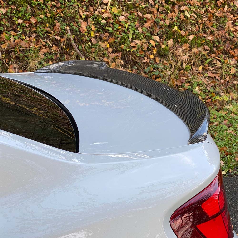 BMW M2 carbon fibre spoiler by CT Carbon, F87 and F22 2 Series, front view showing sleek aerodynamic design.