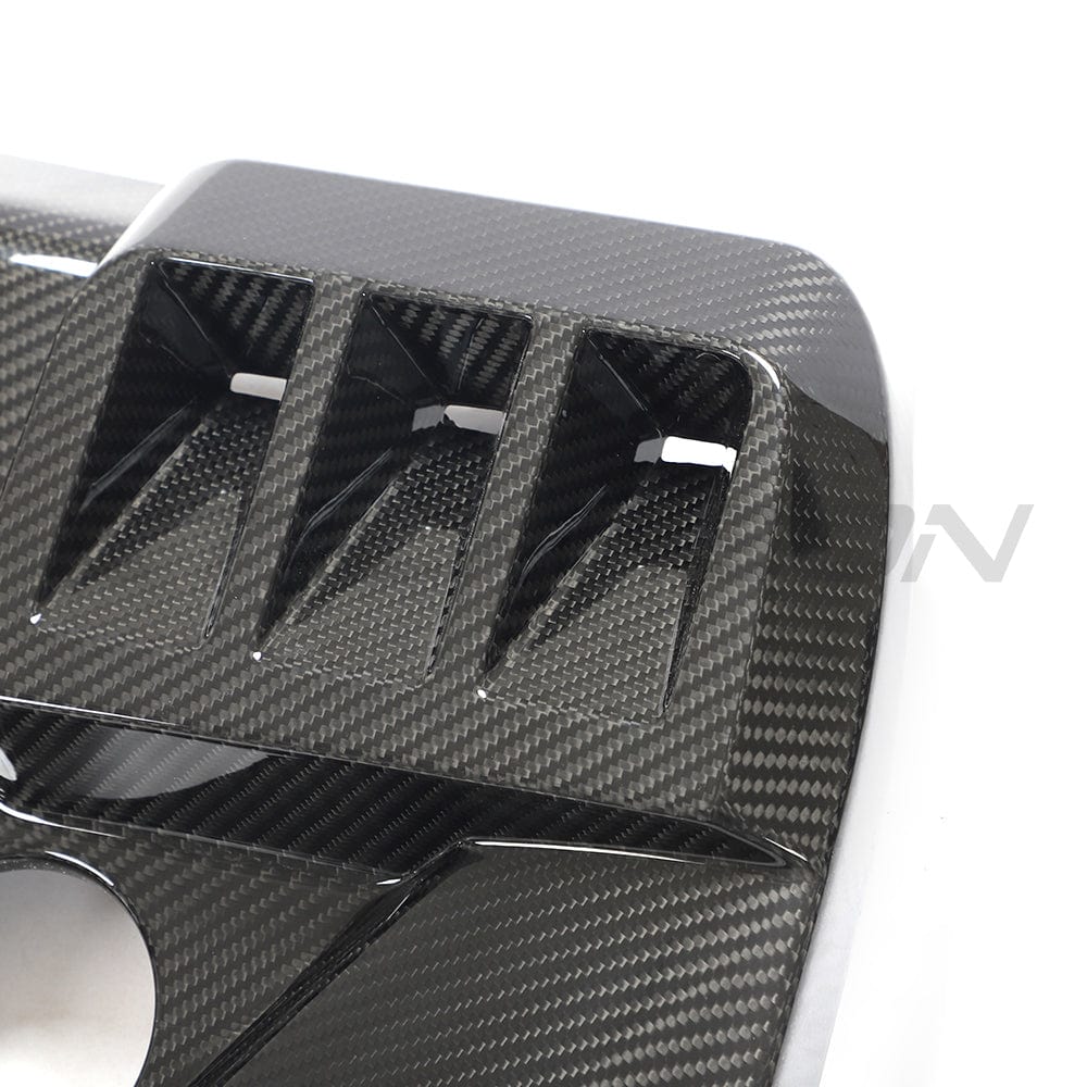 BMW M2, M3, M4 G87/G80/G81/G82/G83 carbon fiber engine dress-up kit by CT Carbon showing sleek, textured carbon fiber components.