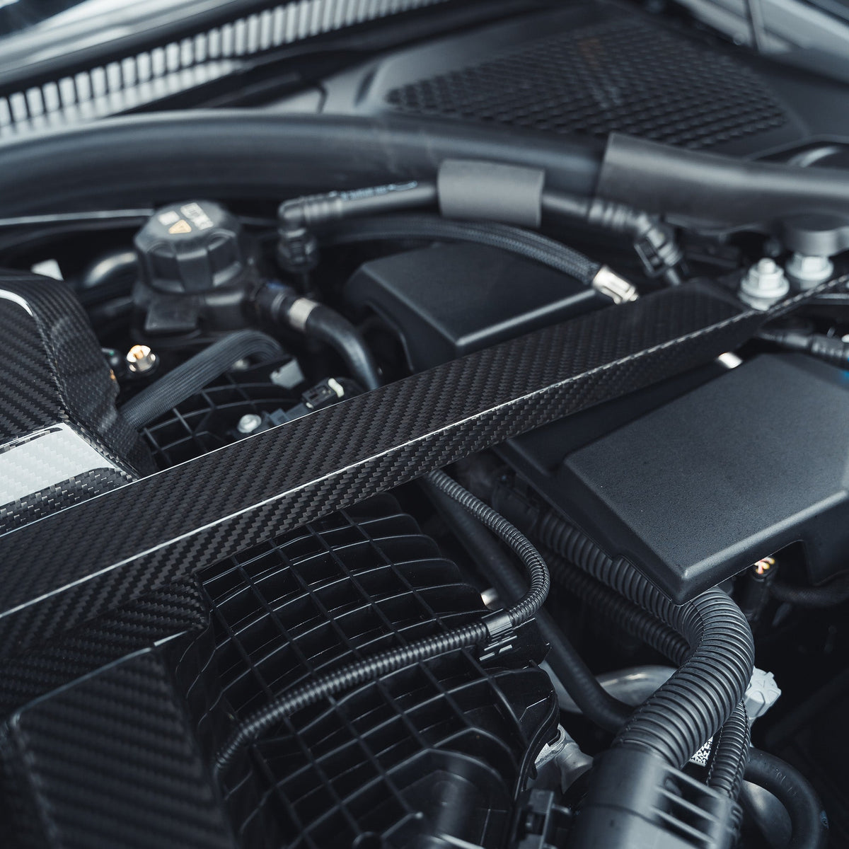 BMW M2, M3, M4 G87, G80, G81, G82, G83 Carbon Fibre Engine Strut Brace by CT Carbon, showing the sleek carbon fiber design.