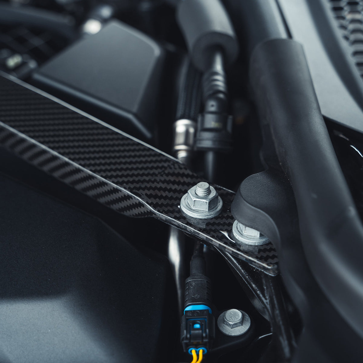 BMW M2, M3, M4 G87, G80, G81, G82, G83 carbon fibre engine strut brace by CT Carbon, showing lightweight performance accessory.