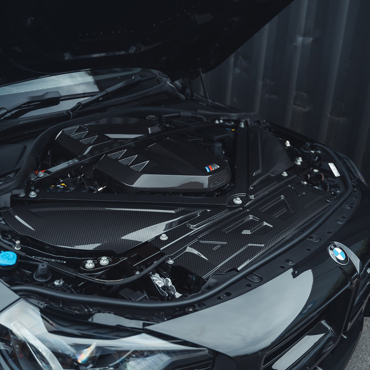 BMW M2, M3, M4 G87, G80, G81, G82, G83 Carbon Fibre Slam Panel Cover by CT Carbon, close-up view of the lightweight accessory.