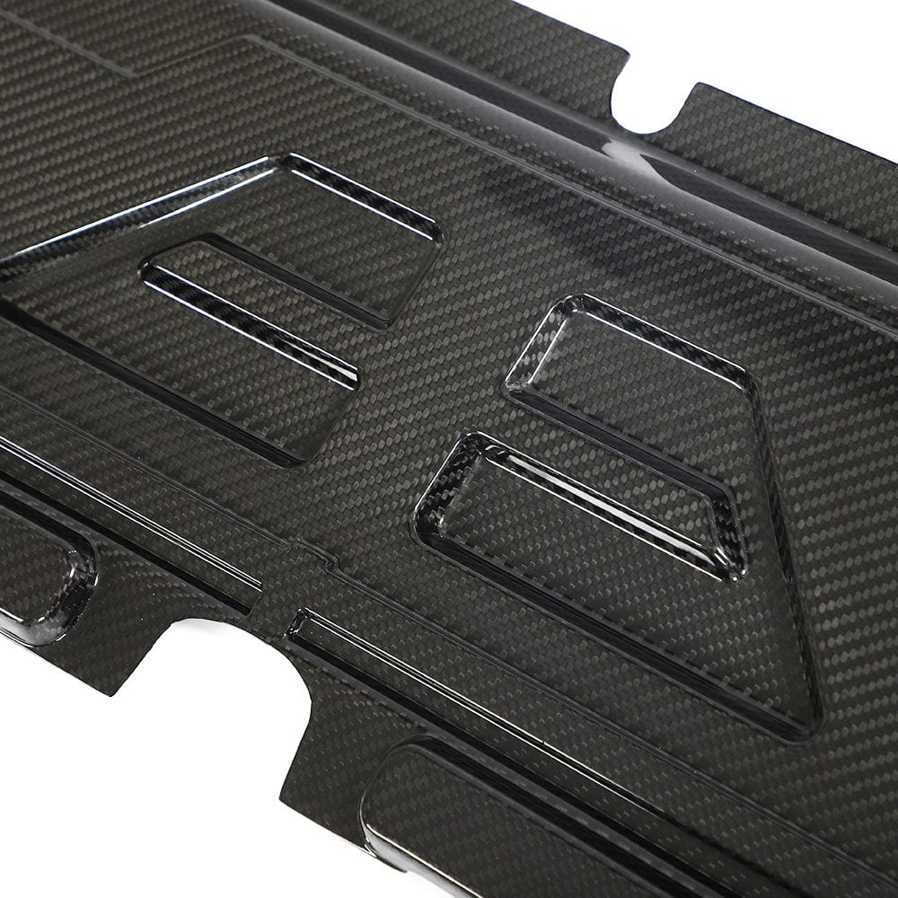 BMW M2, M3, M4 G87 G80 G81 G82 G83 Carbon Fibre Slam Panel Cover by CT Carbon, close-up of sleek automotive accessory
