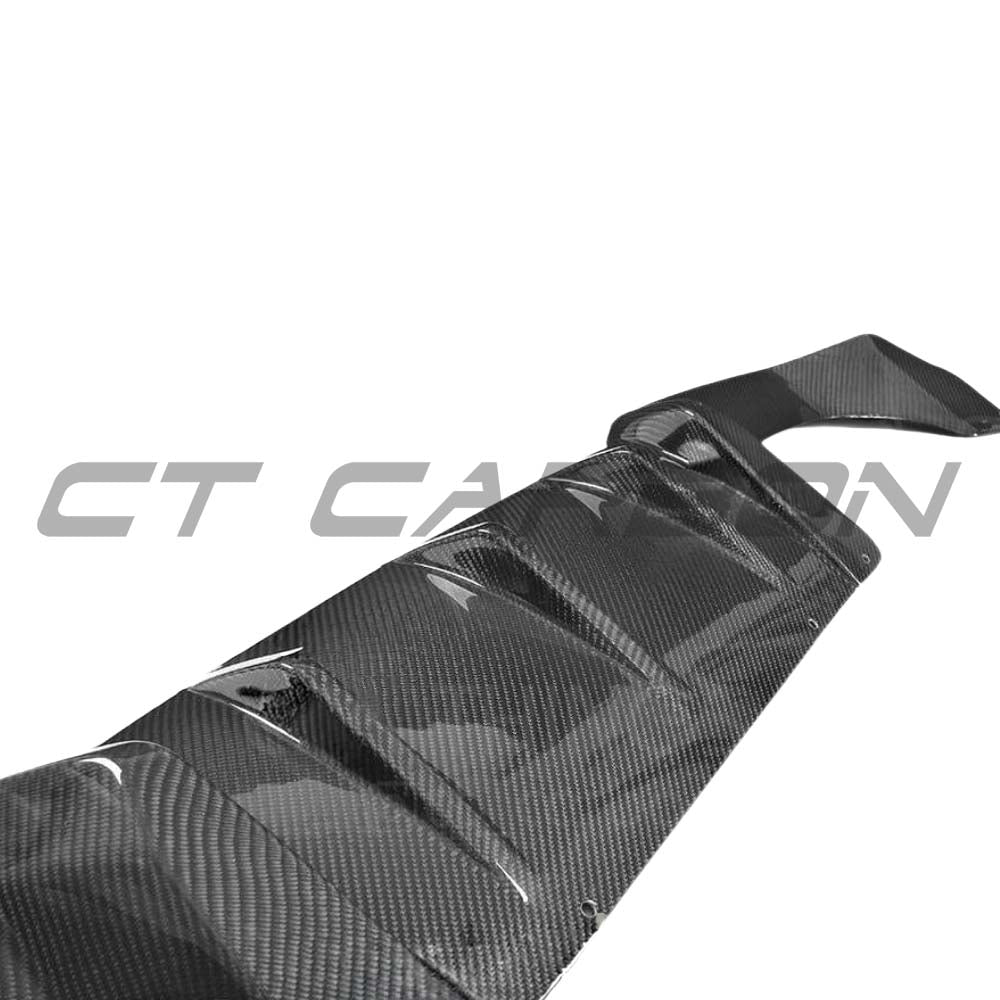 BMW M2 M2C F87 carbon fiber diffuser by CT Carbon, V2 style, showcasing sleek carbon fiber design and aerodynamic features.