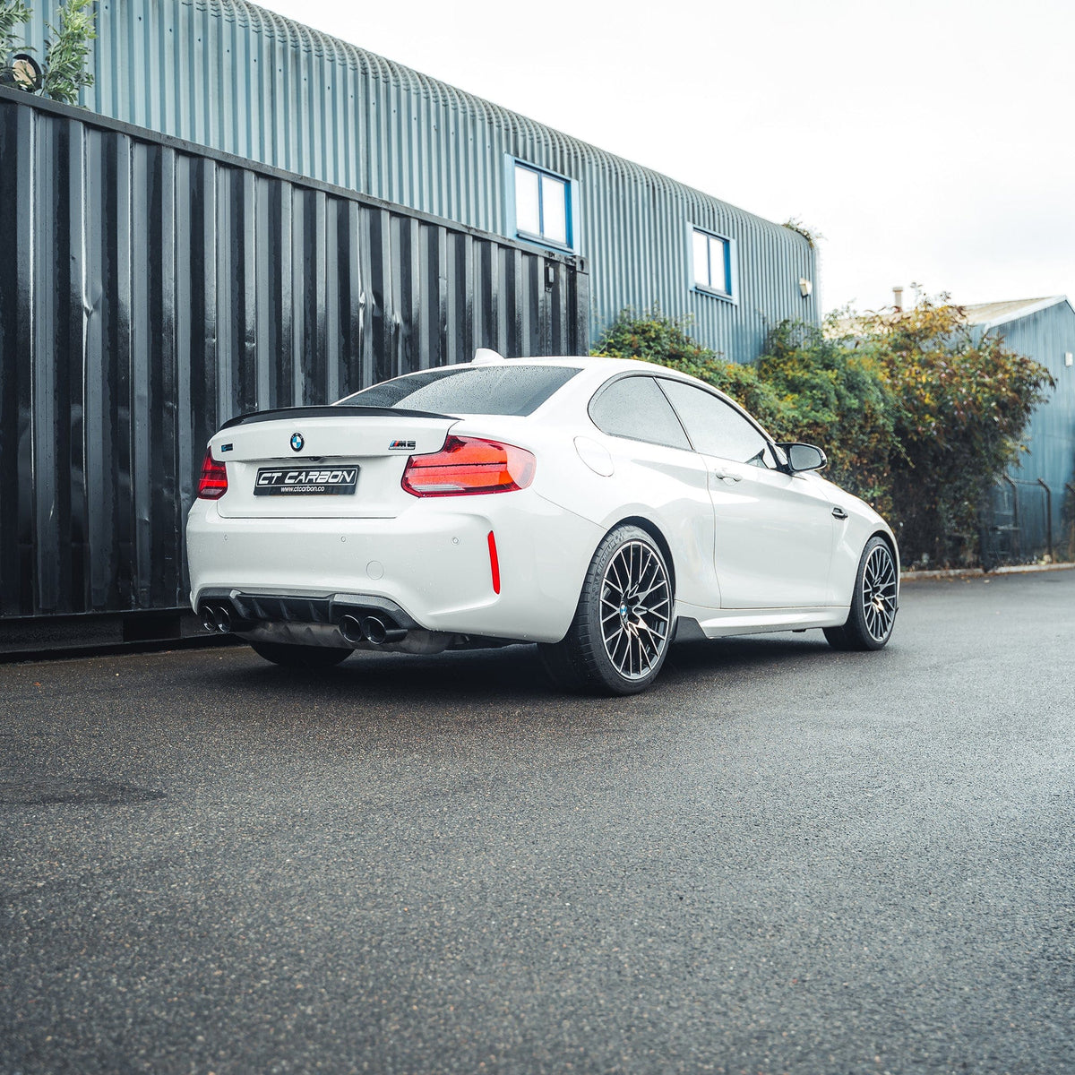BMW M2 F87 M2C F22 carbon fibre spoiler by CT Carbon, rear view showing sleek, lightweight aerodynamic design on the car.