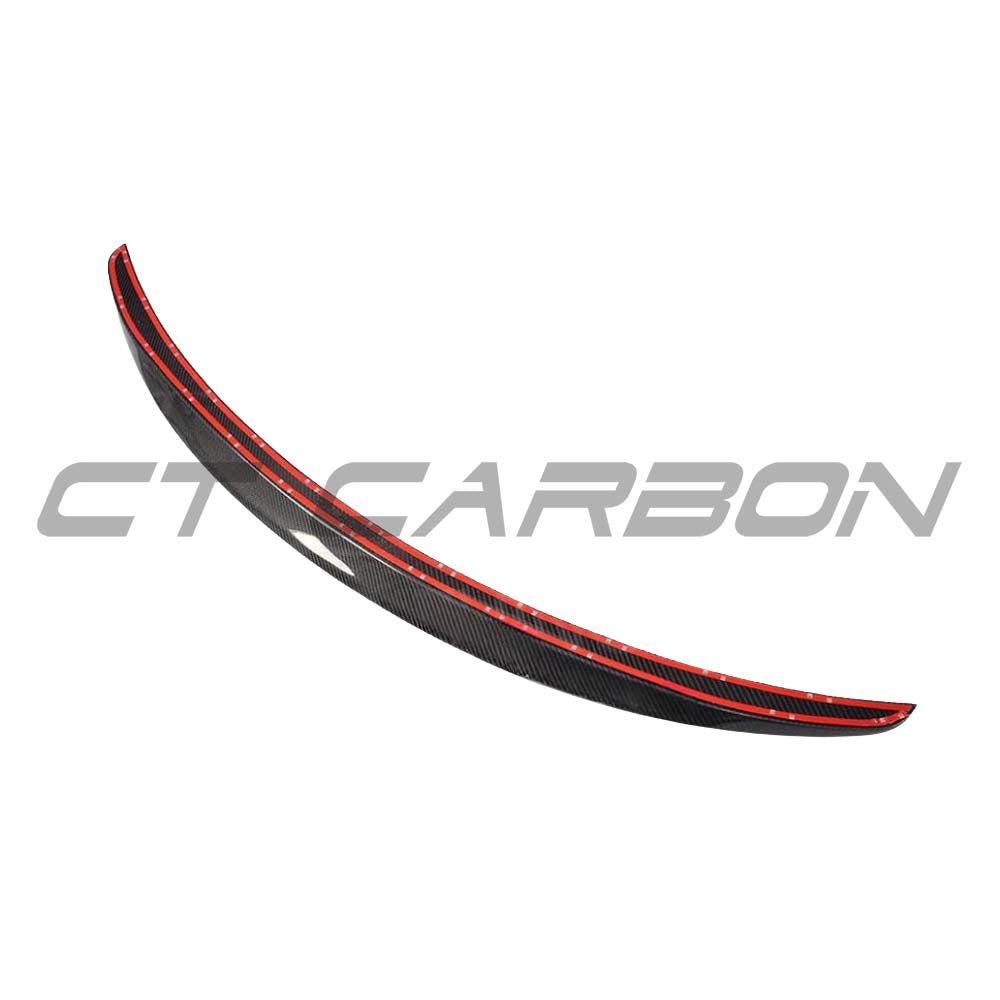 BMW M2 F87 M2C F22 carbon fibre spoiler by CT Carbon, shown from the side with sleek, aerodynamic design and matte finish.