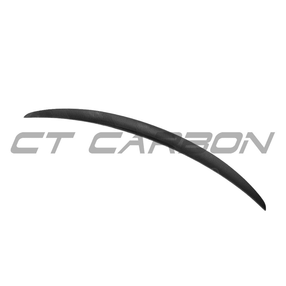 BMW M2/M2C F87/F22 carbon fibre spoiler by CT Carbon, showcasing the sleek, aerodynamic design on the car's rear.