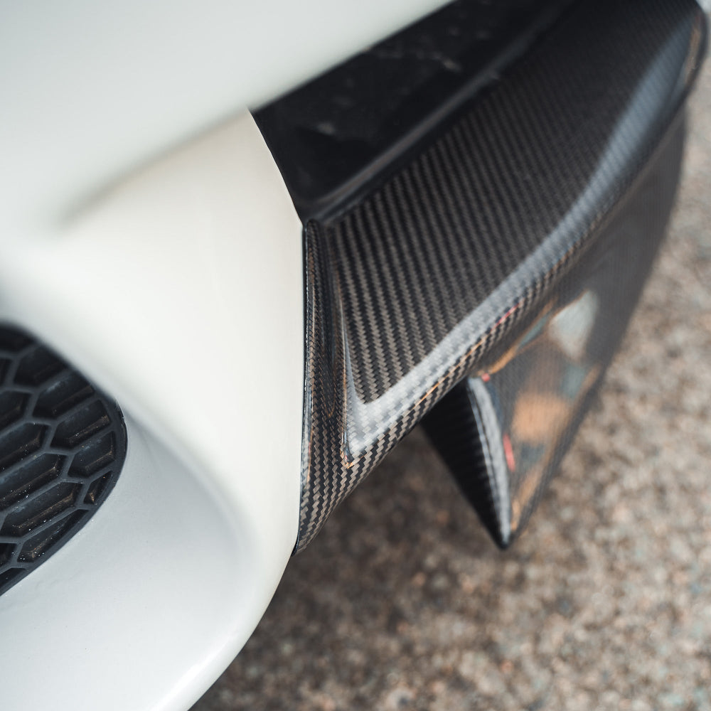 BMW M3 E92/E90 carbon front canard splitters by CT Carbon, featuring a sporty MP style design.