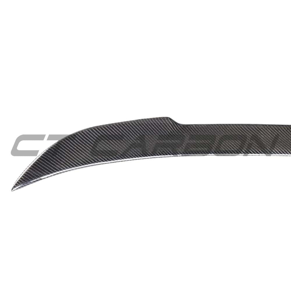 BMW M3 F80 and F30 3 Series carbon fibre spoiler by CT Carbon, V2 style, showing sleek aerodynamic design on the car.