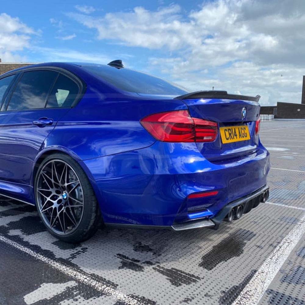 BMW M3 F80 and F30 3 Series carbon fibre spoiler by CT Carbon, V2 style, shown on the car's rear with a sleek, aerodynamic design.