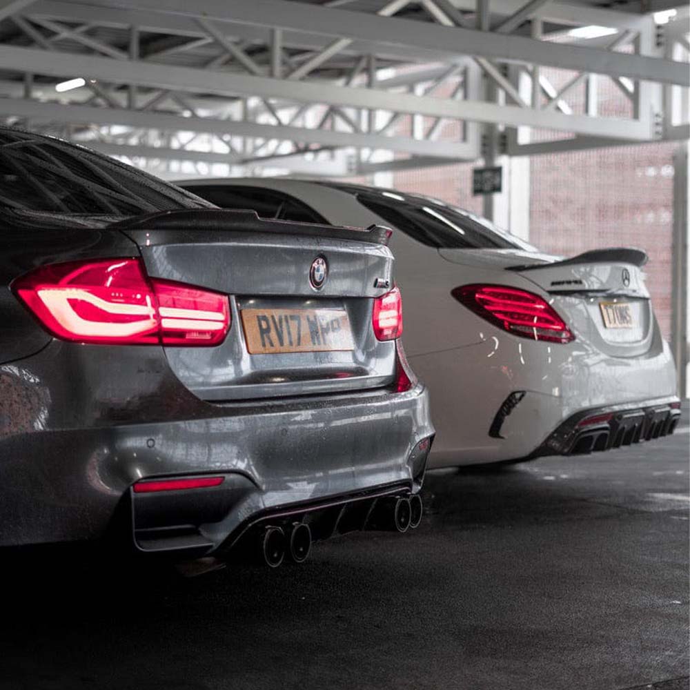 BMW M3 F80 and F30 carbon fibre spoiler by CT Carbon, V2 style, showing the sleek aerodynamic design on the car's rear.