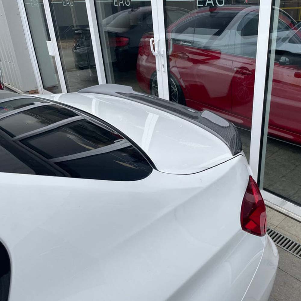 BMW M3 F80 and F30 3 Series carbon fibre spoiler by CT Carbon, V2 style, showing sleek, aerodynamic design on a car exterior.