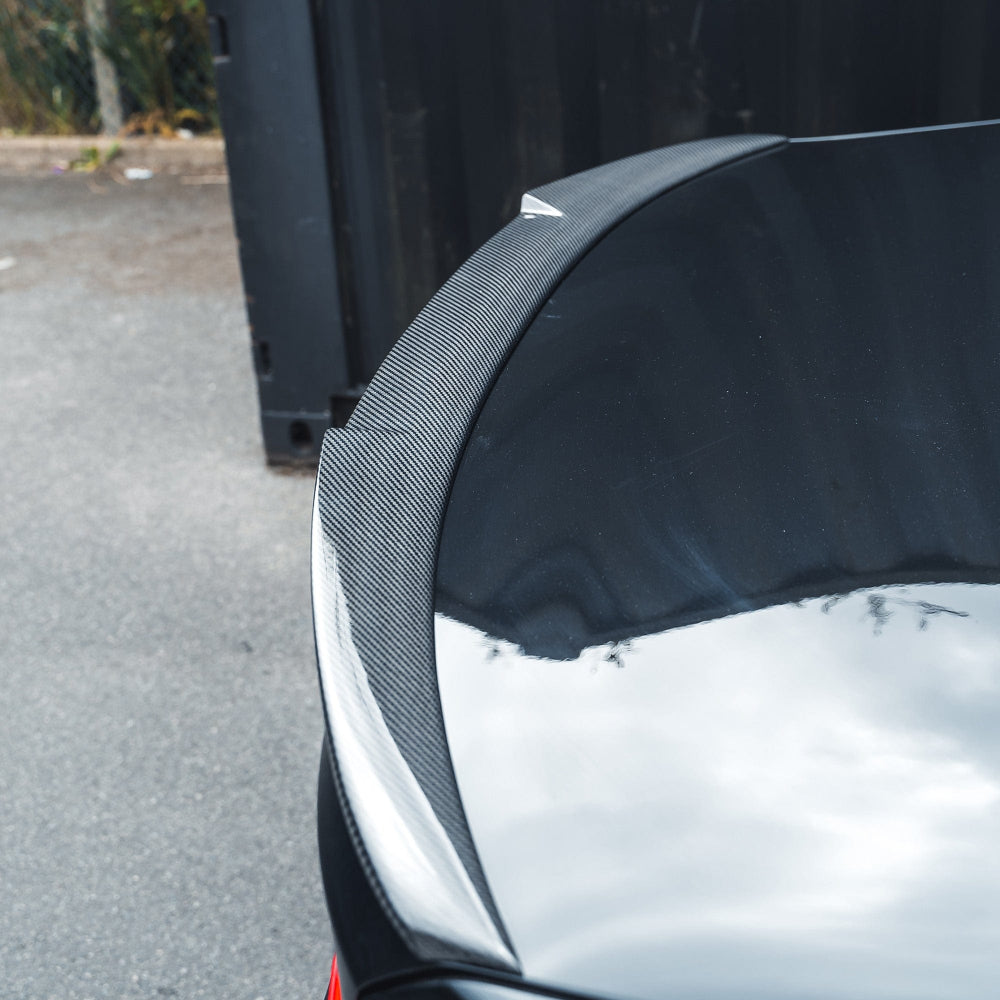 BMW M3 F80 and F30 3 Series carbon fiber spoiler by CT Carbon, showcasing a sleek, V-style aerodynamic rear spoiler.