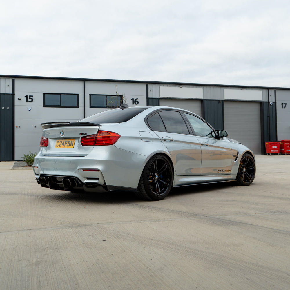 BMW M3 F80 F30 3 Series CT Carbon pre-preg carbon fibre spoiler V2 installed on the car, showcasing sleek aerodynamic design.