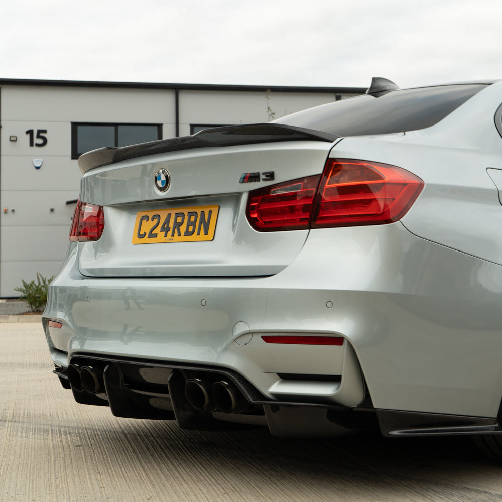 BMW M3 F80 F30 3 Series CT Carbon pre-preg carbon fiber spoiler, V2 model, with sleek aerodynamic design and glossy finish.
