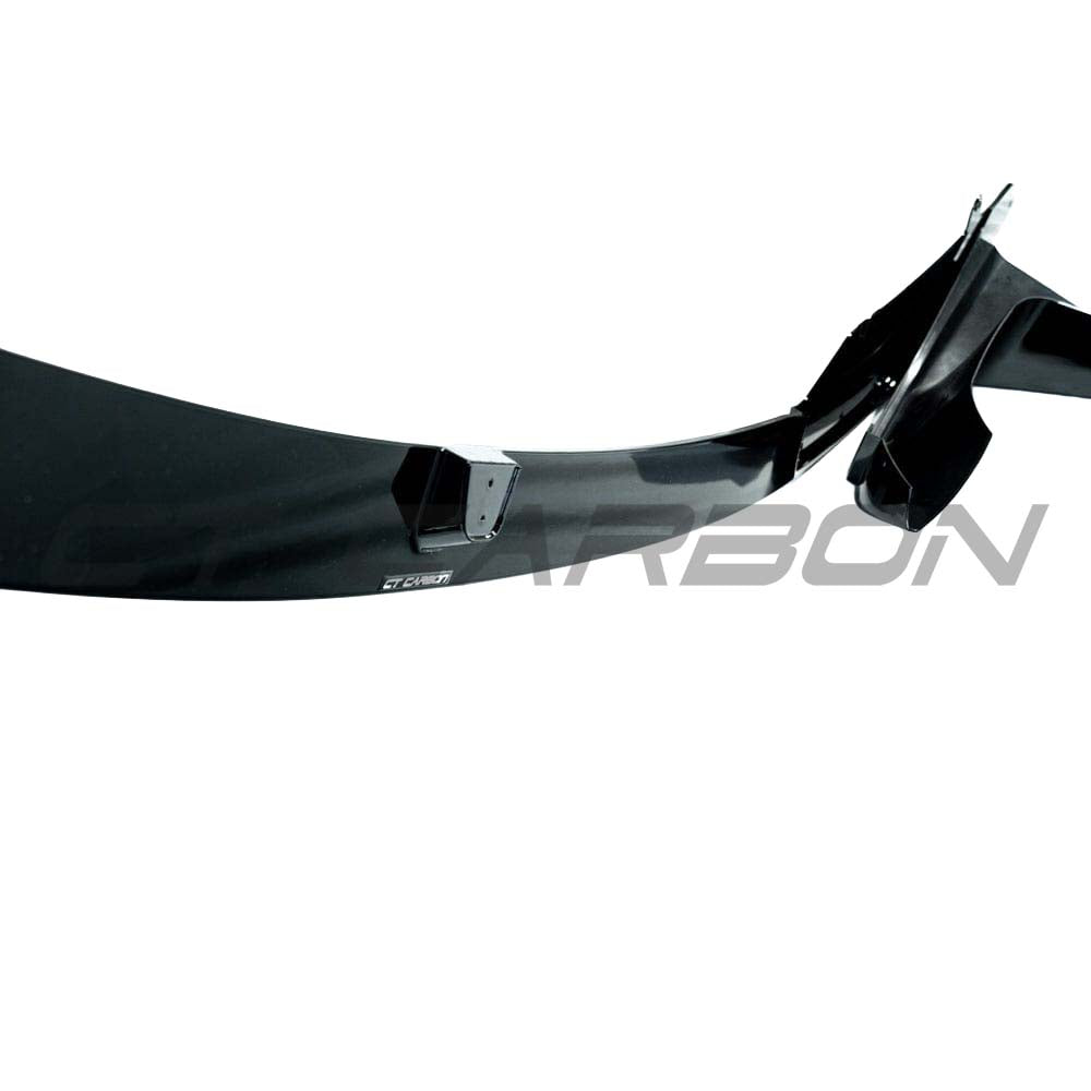 BMW M4 F83 convertible with CT Carbon full gloss black kit, showcasing sleek carbon fiber accents on the car's exterior.