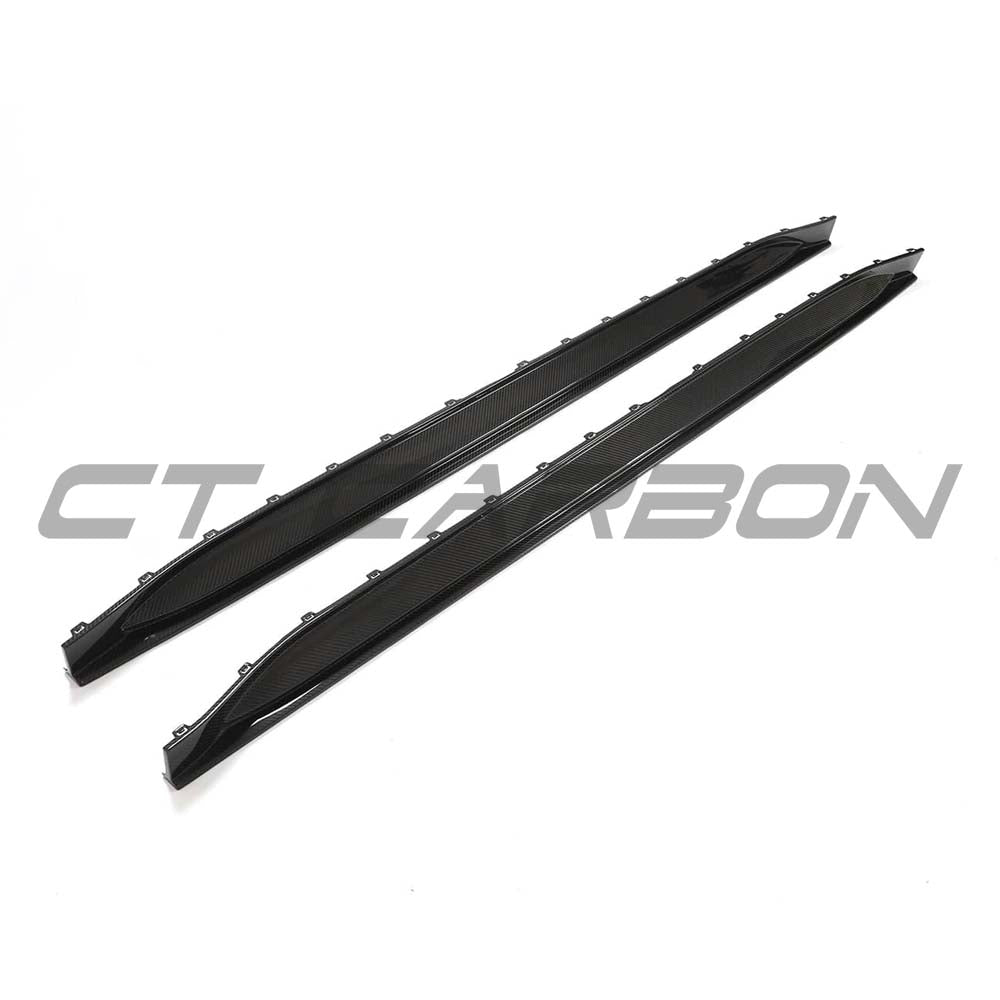 BMW G80 M3 full carbon fibre side skirt replacement kit by CT Design, featuring sleek black carbon fibre finish on the car side.