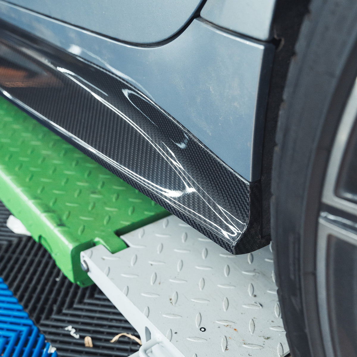 BMW M3 G80 G81 carbon fiber side skirt replacement by CT Carbon, showing the sleek, lightweight design and textured finish.