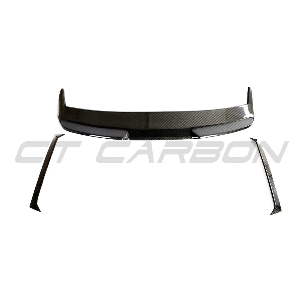 BMW M3 G81 G21 carbon fiber spoiler by CT Carbon, showcasing sleek, aerodynamic design on a sporty car.