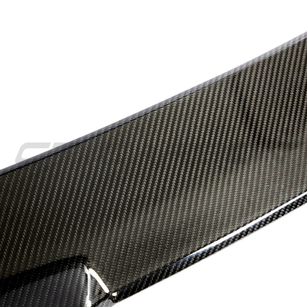 BMW M3 G81 G21 carbon fiber spoiler by CT Carbon, V2 design, mounted on the 3 Series car, showing sleek aerodynamic styling.