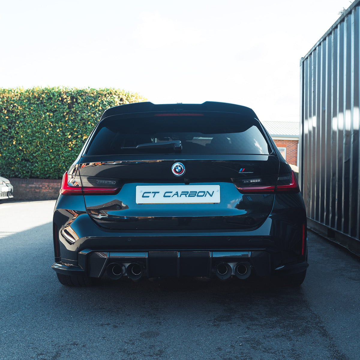 BMW M3 G81 G21 carbon fibre spoiler by CT Design, showcasing the sleek, aerodynamic V2 spoiler on the car's rear.