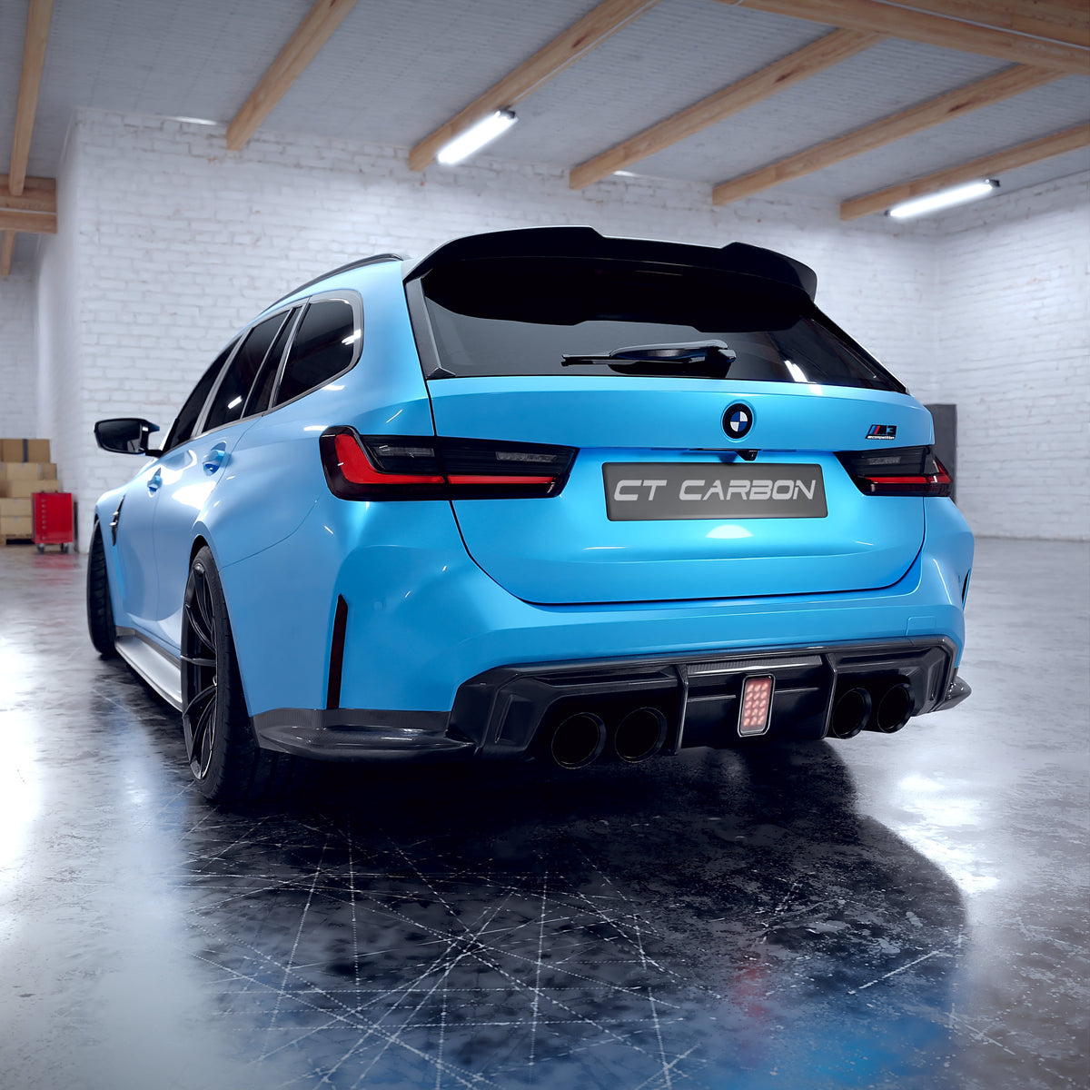 BMW M3 G81 G21 carbon fibre spoiler by CT Carbon, V2 style, mounted on the car, showcasing sleek aerodynamic design.