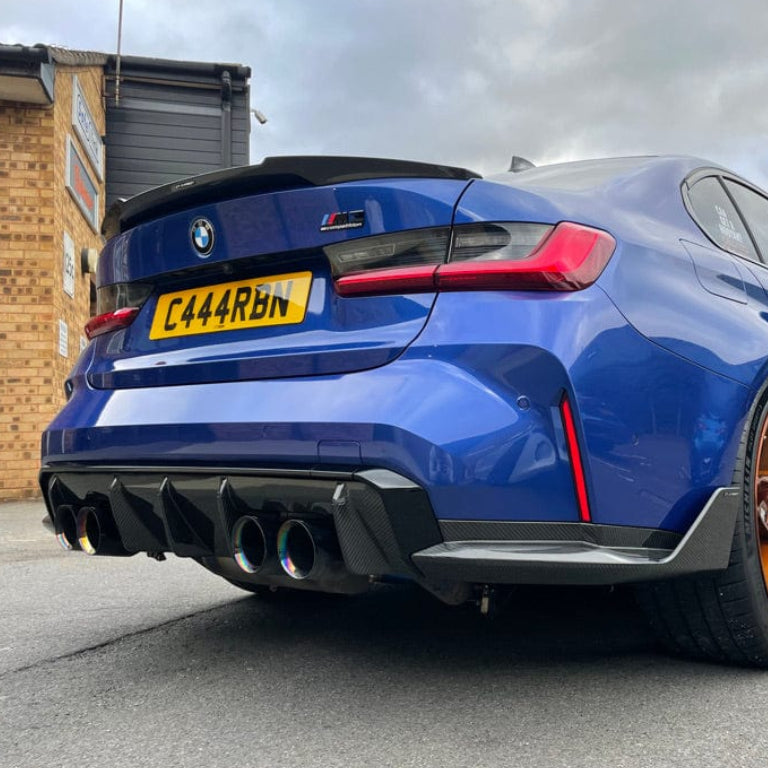 BMW M3 G80 G20 2018+ CT Carbon wet carbon fibre spoiler, V3 style, with sleek aerodynamic design on a car.