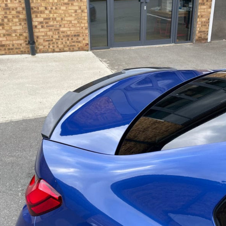 BMW M3 G80 G20 2018+ CT Carbon wet carbon fibre spoiler V3 style installed on the vehicle, showcasing sleek aerodynamic design.