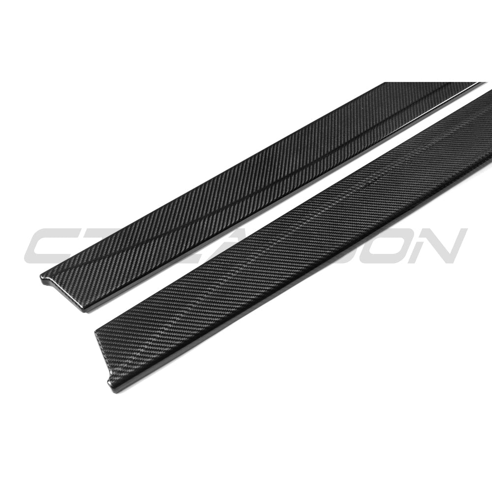BMW M3 M4 F80 F82 F83 2014-2020 CT Carbon pre-preg carbon fiber side skirts installed on the vehicle.