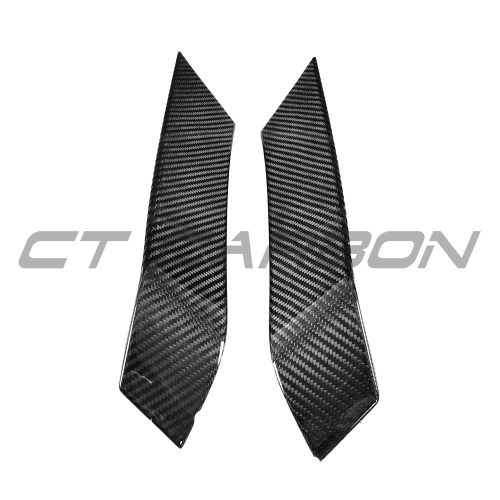 BMW M3 M4 F80 F82 F83 carbon fiber upper front canards by CT Carbon, showing sleek aerodynamic accessories on a sports car.