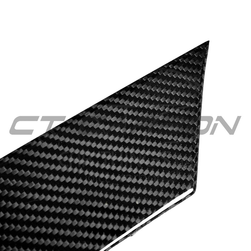 BMW M3/M4 F80 F82 F83 carbon fiber canards, front upper aerodynamic accessories by CT Carbon, mounted on a sports car.
